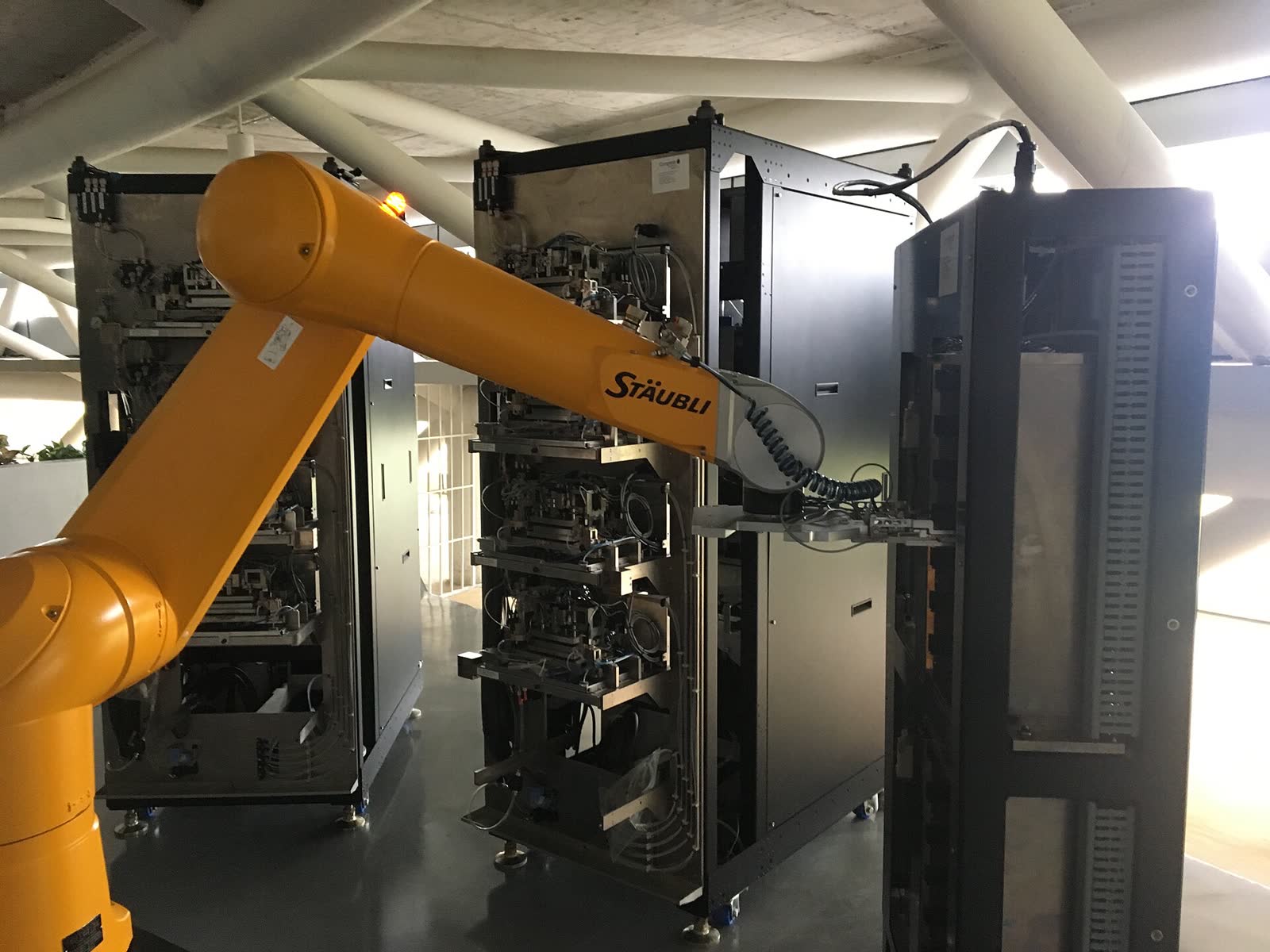 Robotic arm loading samples into an automated DNA sequencer